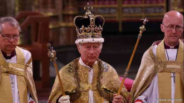 King Charles III crowned with regal pomp, cheers and shrugs