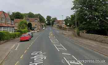 Driver injured after car crashes into parked vehicles near Scarborough