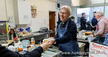 Archbishop of Canterbury rocks Bon Jovi apron as he helps charity serve lunch