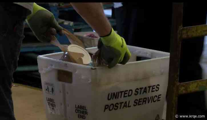 Postal workers collecting food for Stamp Out Hunger event