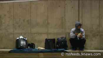 Arriving migrants spend Wednesday in parking garage waiting for shelter
