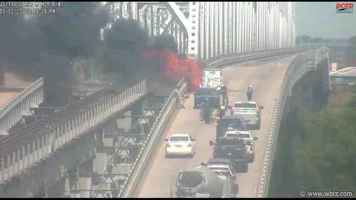 Burning car shuts down eastbound traffic on US 190 at the Old Bridge