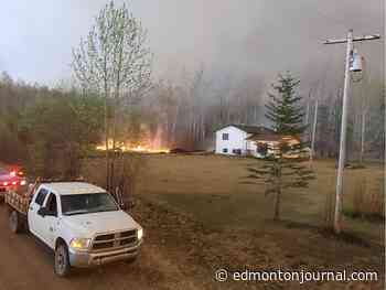 Near-miss with bulldozer on Grande Prairie County wildfire scene prompts calls for residents to co-ordinate with local governments