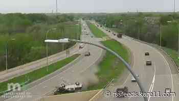 WATCH: Truck flips over barrier, drops several feet onto highway near Arden Hills