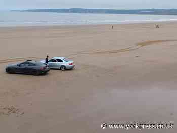 Public forced to flee after two BMWs driven along beach at Filey