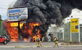 Firefighters battle flames at gas station on Cyrville Road Monday