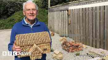 Man makes model buildings on Tresco using periwinkle shells