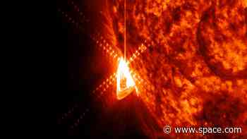 Powerful solar flare erupts from hidden sunspot sparking widespread radio blackouts (video)