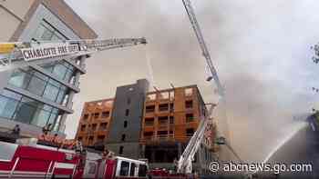2 construction workers missing after massive fire erupts at site