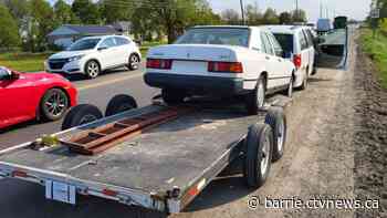 Improperly secured car results in charges after it smashes into back of van