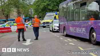 Road shut for hours after woman hit by bus