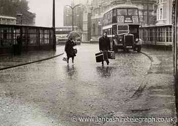 Happy holidaymakers on Blackburn Boulevard in a downpour