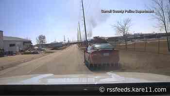 Iowa officer clings to fleeing car in newly released body camera footage