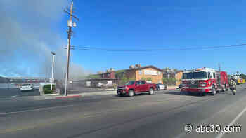 Firefighters fighting an apartment complex fire in east central Fresno