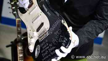 Guitar smashed by Nirvana's Kurt Cobain sells for nearly $900,000