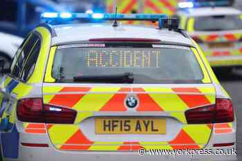 Grey Jaguar and BMW motorcycle crash on B1222 near York