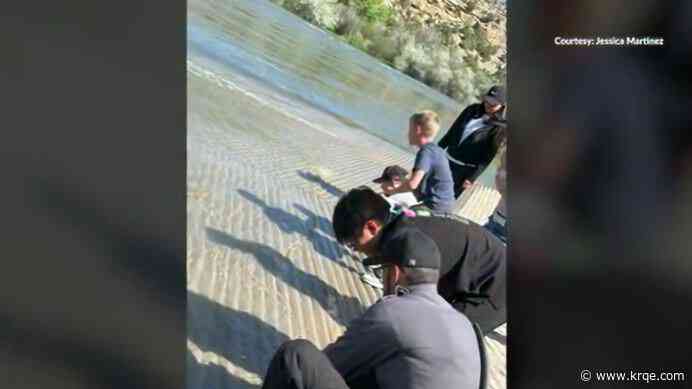 Aztec students release rainbow trout into wild for class project