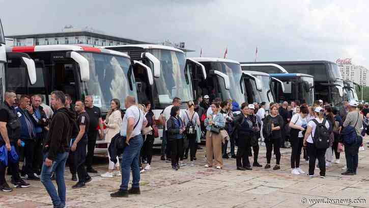 Serbians converge in country's capitol for pro-government rally following mass shootings