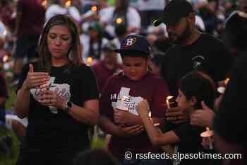 Hundreds honor the 21 Uvalde victims during a candlelight vigil one year after shooting