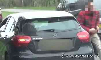 Moment furious driver storms out car with knife and slashes speed camera van's tyre