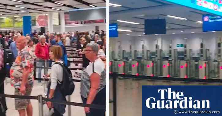 Videos show long queues and closed e-gates at Gatwick airport after IT issues – video