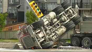 Dump truck tips over in northwest Calgary