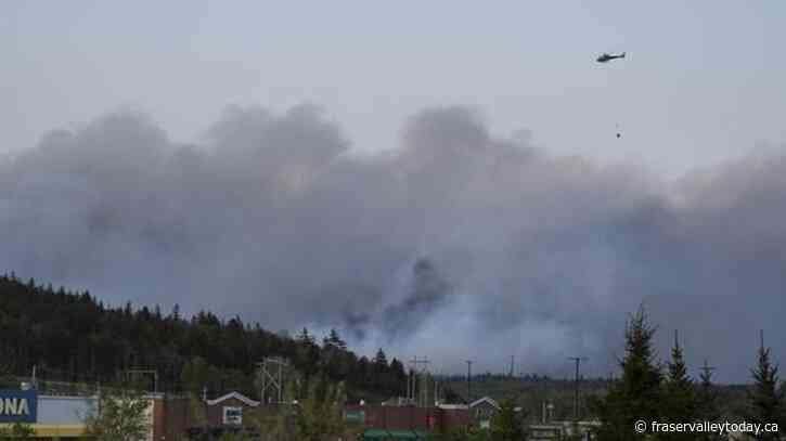 Thousands flee wildfires near Halifax : In The News for May 29