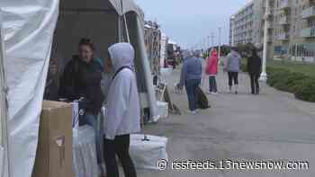 The show must go on! Artists tough out bad weather at Virginia Beach Surf Art Expo