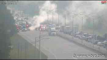 Burning car shuts down I-12 East near Millerville Road; one person badly hurt