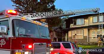 Calgary fire engulfs one home, damages neighbouring abandoned property