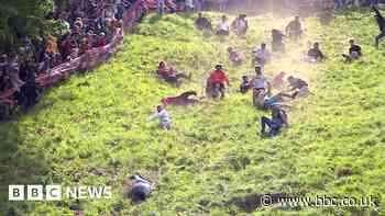 Watch: Cheese rollers run down near-vertical hill