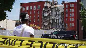 Officials delay demolition of partially collapsed building amid renewed search