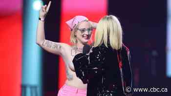 Topless Junos protester pleads guilty to trespassing, agrees to pay fine