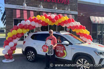 North Okanagan man Rolls Up new Volkswagen with Tim Hortons coffee
