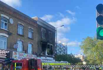 Firefighters at Canning Town flat fire save three children