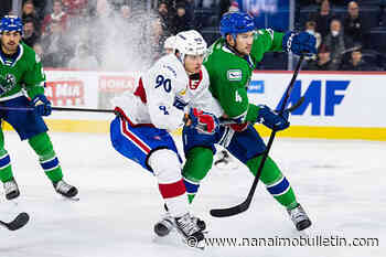 Vancouver Canucks sign defenceman Jett Woo to 1-year contract