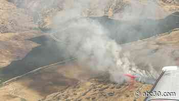 Firefighters working to contain wildfire near Orange Cove