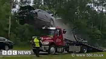 Bodycam footage shows car launching off tow truck's ramp on Georgia highway