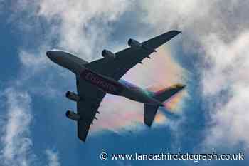 'Rainbow' trails behind plane landing at Manchester Airport