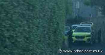 Live as armed police close street in seaside town