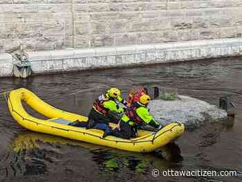 Firefighters rescue man stuck on a rock in fast-moving water