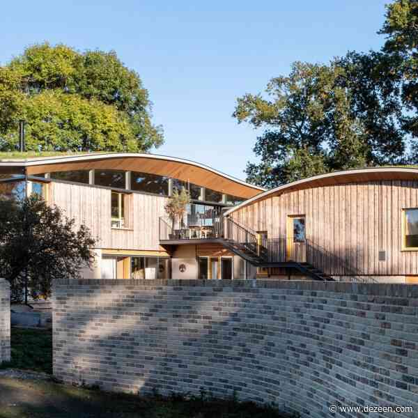 Undulating green roof helps Creek Cabin "live in harmony with the surrounding environment"