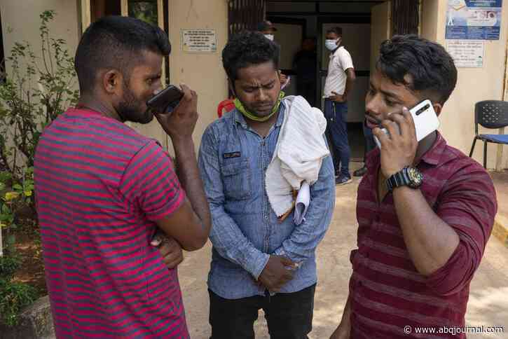 As India grieves train crash that killed 275, relatives try to identify bodies of loved ones