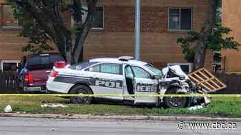 Crash involving police car shuts down stretch of Main Street in Winnipeg