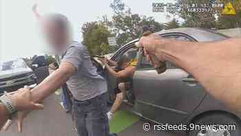 Body-camera video shows officer shoot suspect while pulling hostage to safety