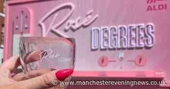 Aldi has erected a huge billboard in the city that pours out free wine when it's sunny