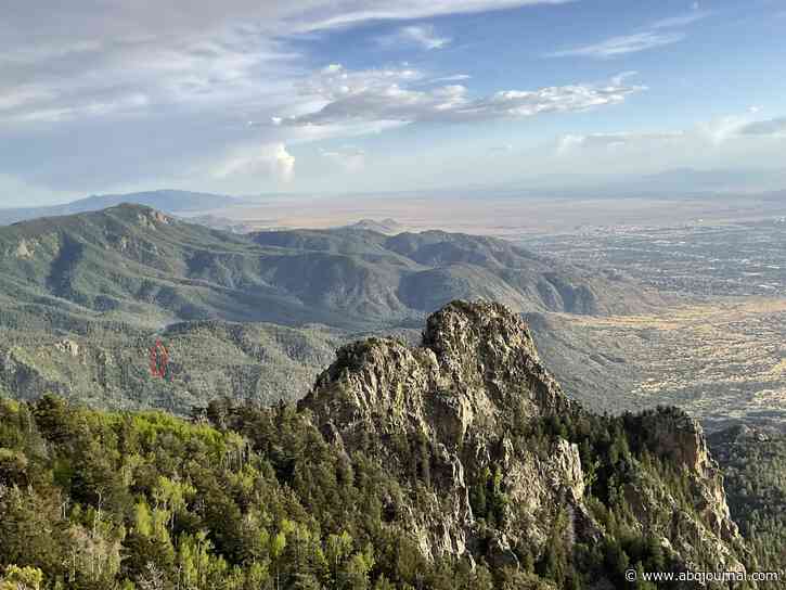 Crews work to extinguish fire in the Sandias