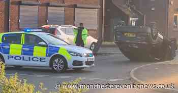 Person rescued from flipped car after it crashed into bollard