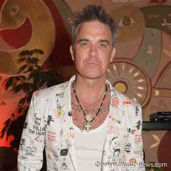 Angels is a song about ANGELS! Robbie Williams shares belief in heavenly beings