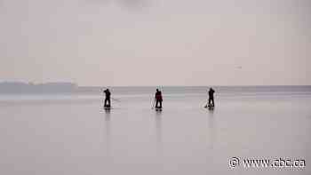 These 3 men are paddle boarding across Lake Ontario to 'stand up' for the Great Lakes